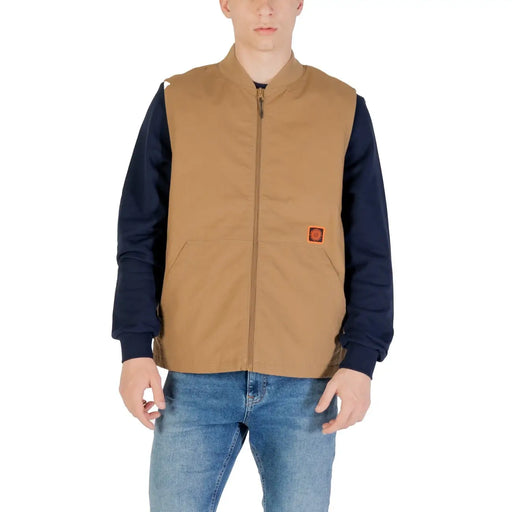 Vans Herrenweste, beige, lange Baumwollmischweste mit Reißverschluss vorne, hellbraune Utility-Weste und orangefarbener Logo-Aufnäher auf der Brust