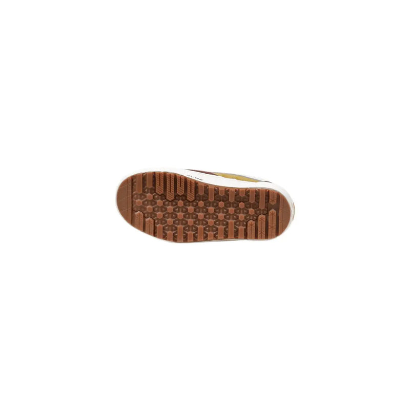 Brown rubber sole with textured patterned tread design of vans women camel leather sneakers