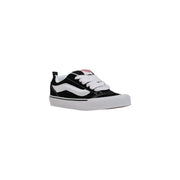 Black and white vans women leather sneakers with canvas upper rubber sole and iconic side stripe for fall wear