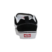 Back side of Vans women leather sneakers black laced fall shoes with suede upper rubber sole and red logo on heel