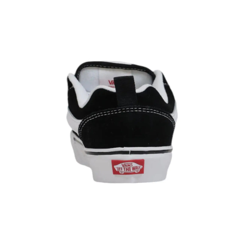 Back side of Vans women leather sneakers black laced fall shoes with suede upper rubber sole and red logo on heel