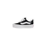 Black and white vans women leather sneakers with thick black rubber soles and old skool platform design