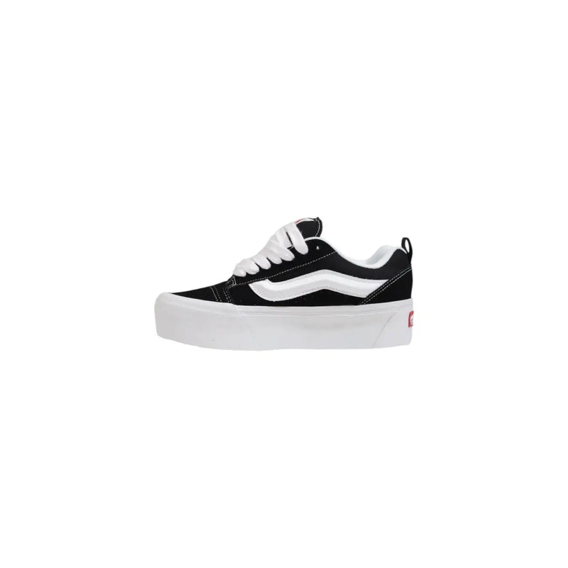 Black and white vans women leather sneakers with thick black rubber soles and old skool platform design