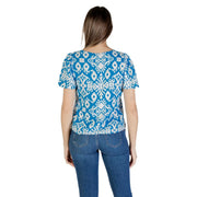 A vibrant blue and white ikat-patterned viscose short sleeve blouse with puffed sleeves by Vero Moda