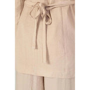 Beige linen belted dress with soft textured fabric and matching self-tie belt shown with vero moda pink blazer