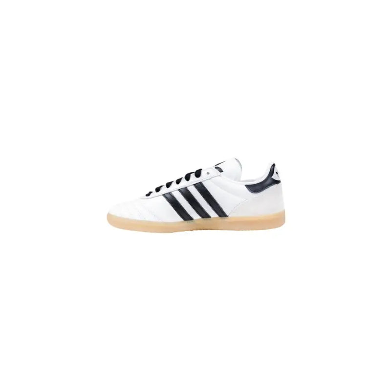 White Adidas slip-on sneakers with black stripes and gum sole for women