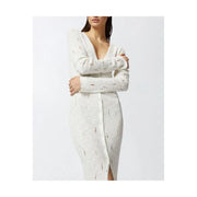 A white cotton knit dress by Pinko with a deep v neckline and front button closure