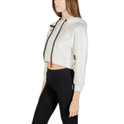 A cropped white hooded cotton blend sweatshirt for women with black drawstrings and subtle side pockets in a minimalist design
