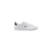 White leather Lacoste sneaker with green heel accent displaying a stylish footwear design