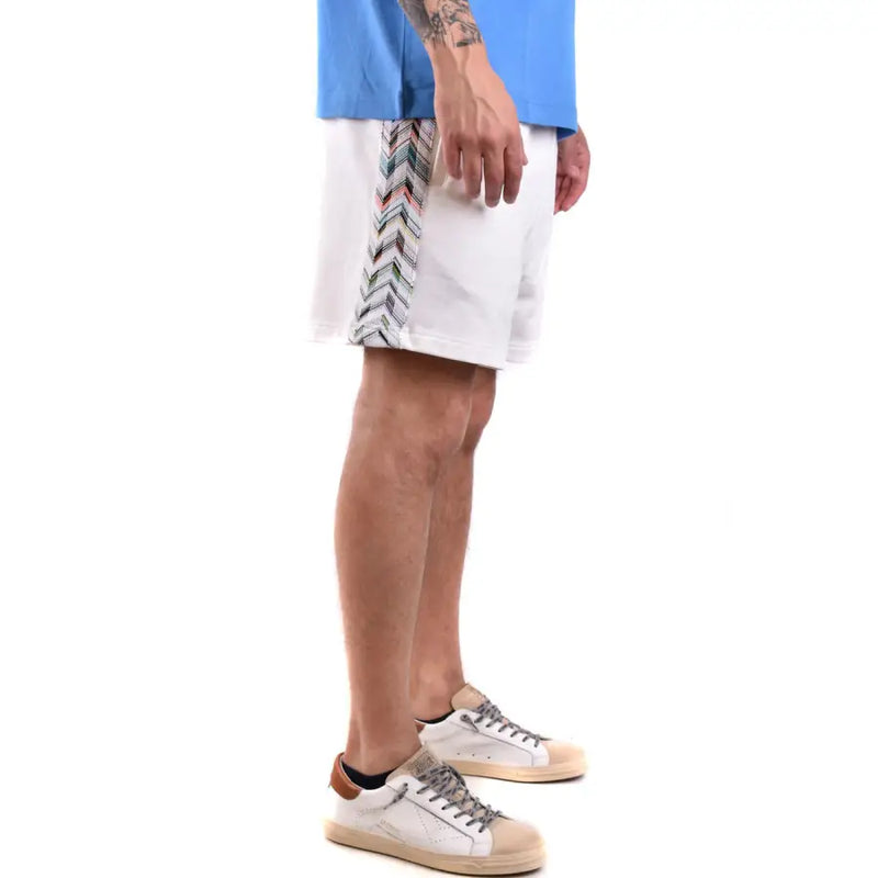 White patterned athletic shorts with zigzag side stripes for activewear comfort