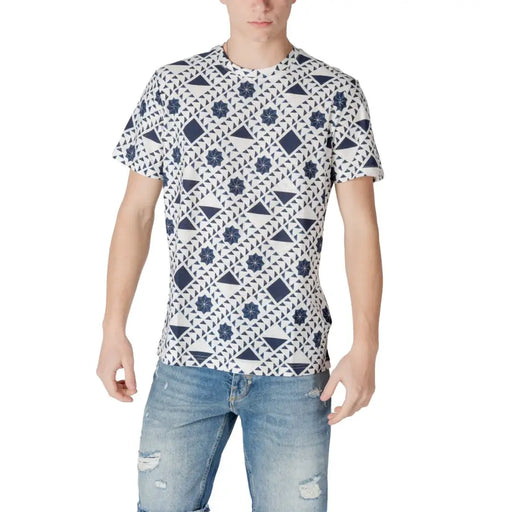 White patterned short sleeve t shirt for men featuring navy blue geometric triangles diamonds and stars on white cotton