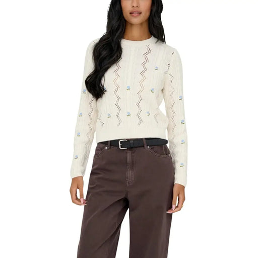 Cream-colored womens long sleeve cotton blend sweater with zigzag cables and floral embroidery