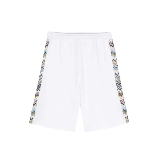 White athletic shorts featuring patterned zigzag side stripes for a stylish sports look