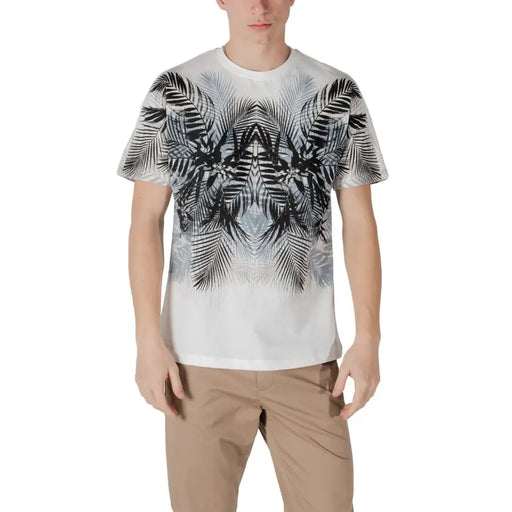 White short-sleeved t shirt with bold black and gray symmetrical palm leaf pattern fading toward the hem