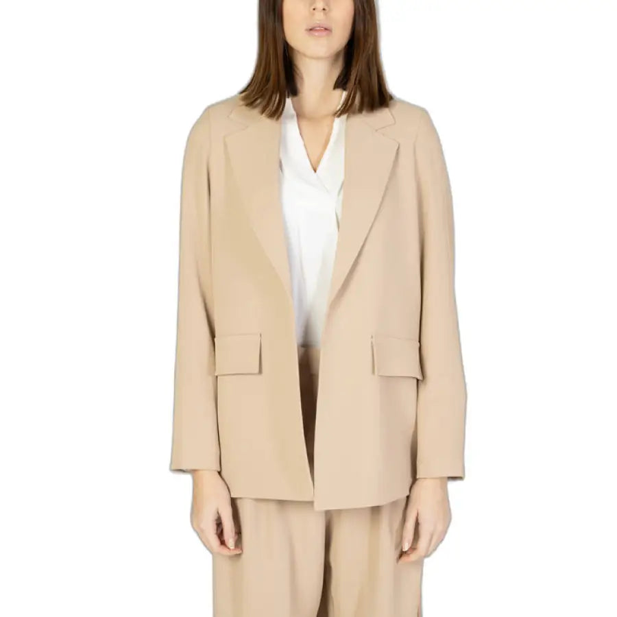 
                      
                        Woman in Sandro Ferrone beige coat and pants for the Sandro Ferrone Women Blazer product
                      
                    