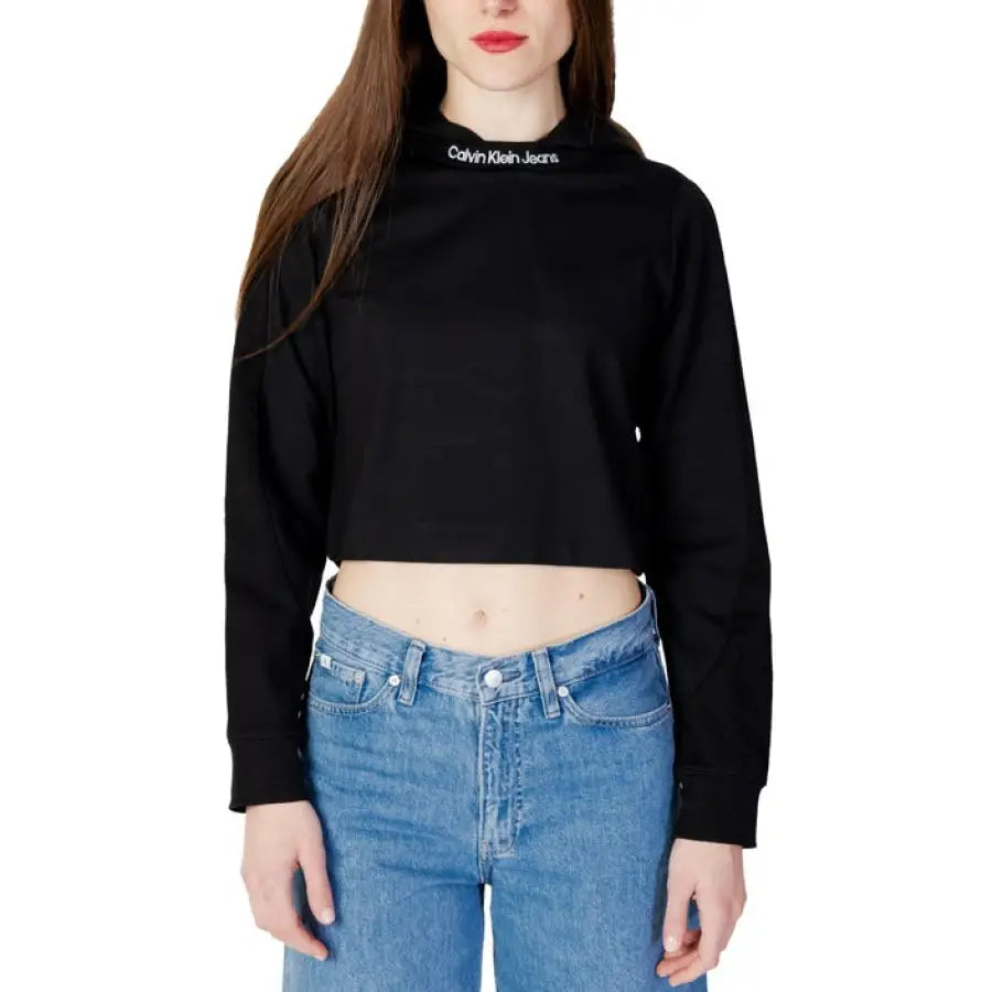 Woman in Calvin Klein Jeans black ’love’ crop top - Calvin Klein Women Sweatshirts