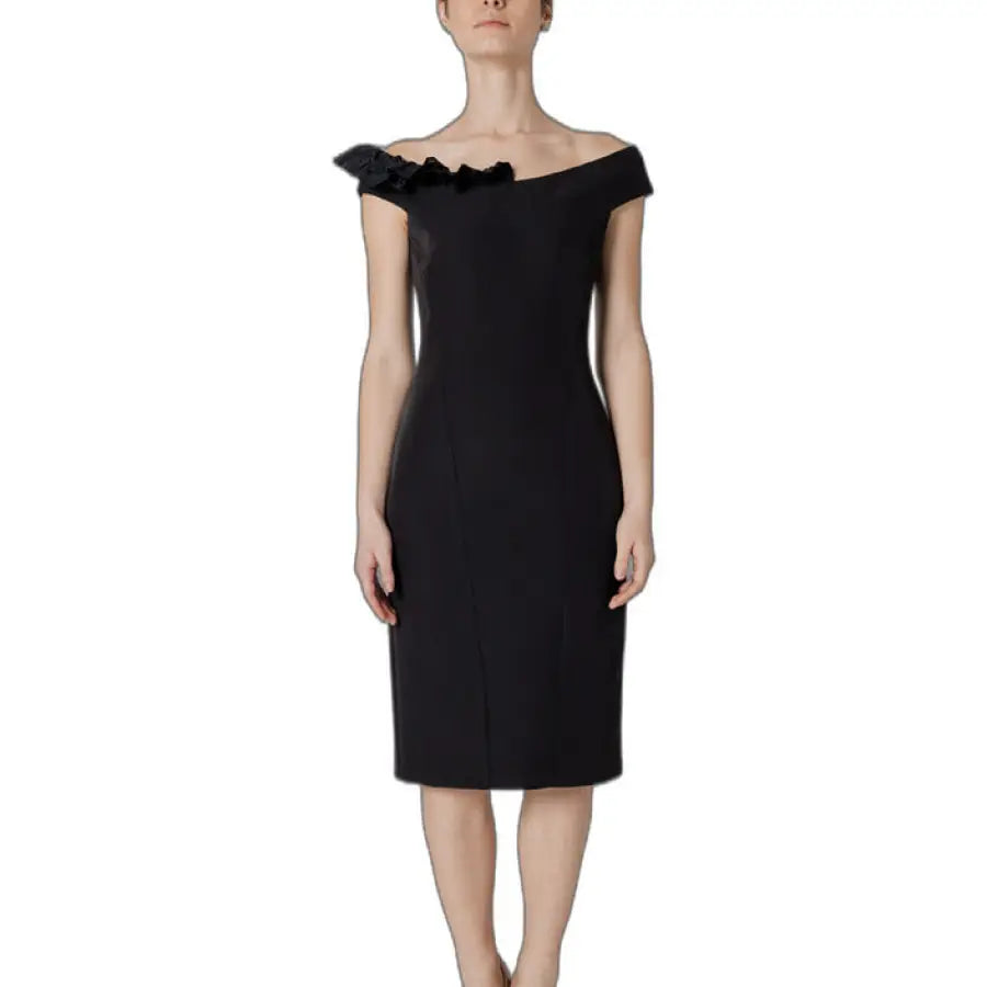 A woman in a Sandro Ferrone black dress, perfect urban style