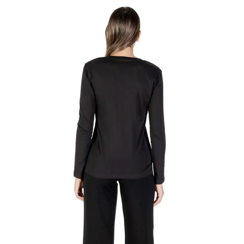 Woman wearing Armani Exchange black long sleeve round neck cotton T shirt