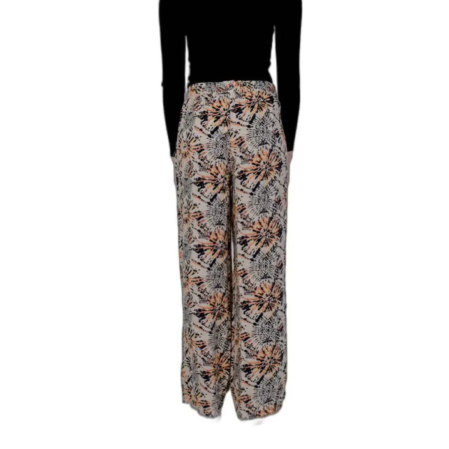 Jacqueline De Yong women trousers featured on model in black top and patterned pants