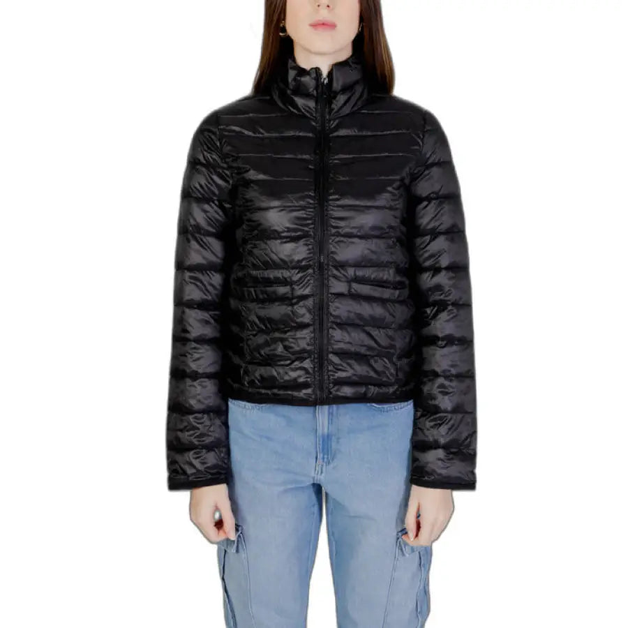 Woman in urban city fashion wearing Only black puffer women jacket