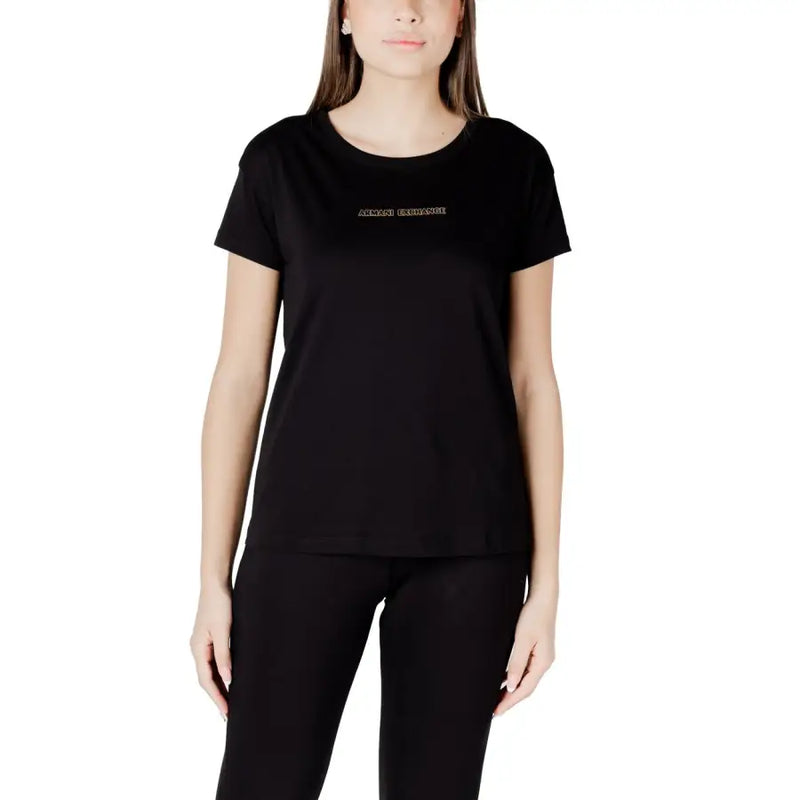 Woman wearing a black short-sleeved T-shirt and black pants showcasing Armani Exchange Women’s White Cotton Print T Shirt