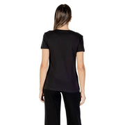 Woman wearing Armani Exchange Womens Black Rhinestone Cotton Tee with black pants