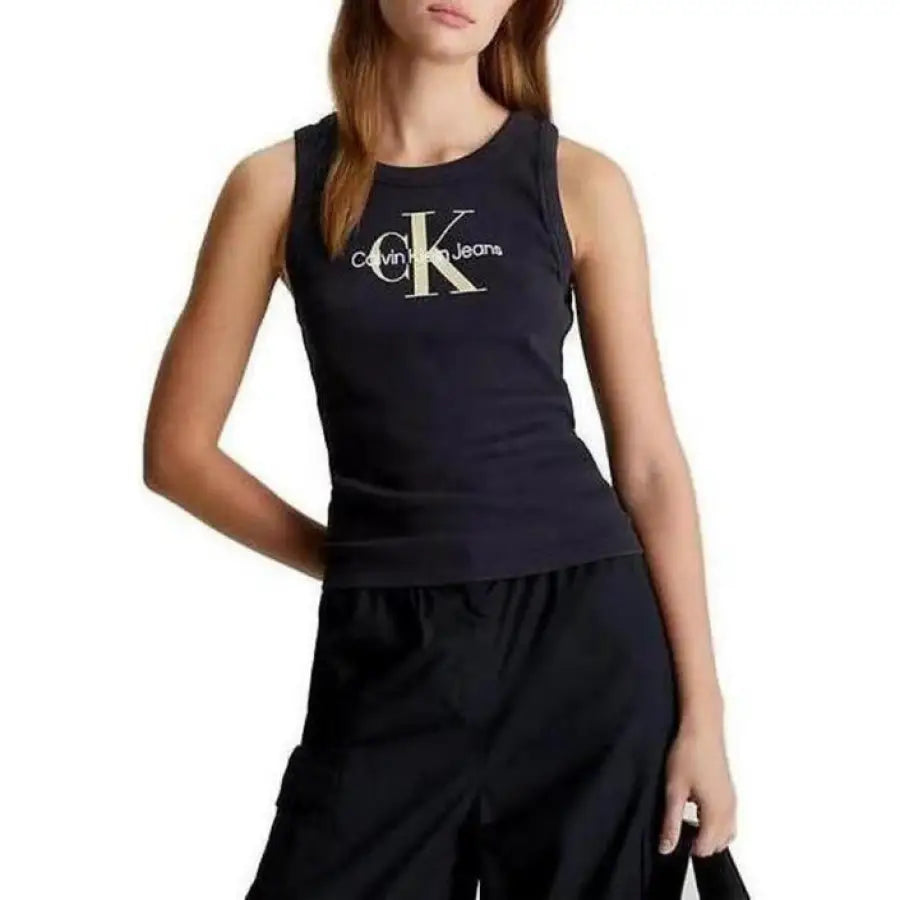 Calvin Klein model in black top and shorts from Calvin Klein Jeans collection