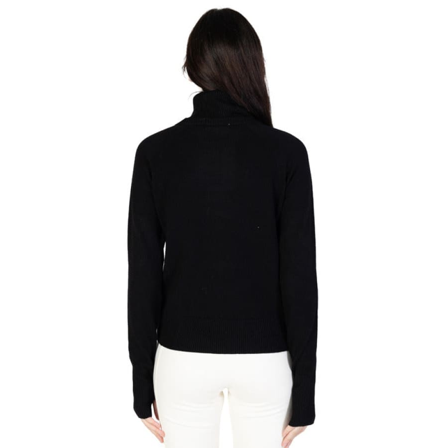 Hinnominate Women Knitwear - Stylish woman in black sweater and white pants