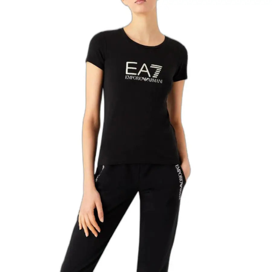 Woman in EA7 EA7 women t-shirt and black pants showcasing product