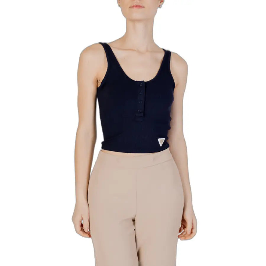 
                      
                        Woman in Guess Active top and tan pants for Guess Active Women collection
                      
                    