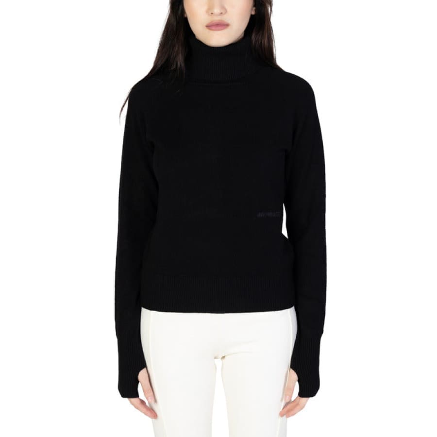 Hinnominate women model showcasing Hinnominate knitwear in black turtle neck sweater
