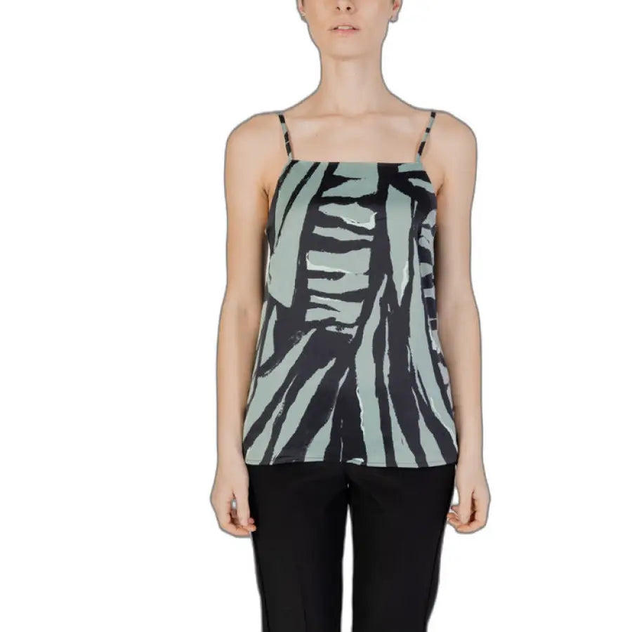 Woman in zebra print undershirt, showcasing urban city fashion