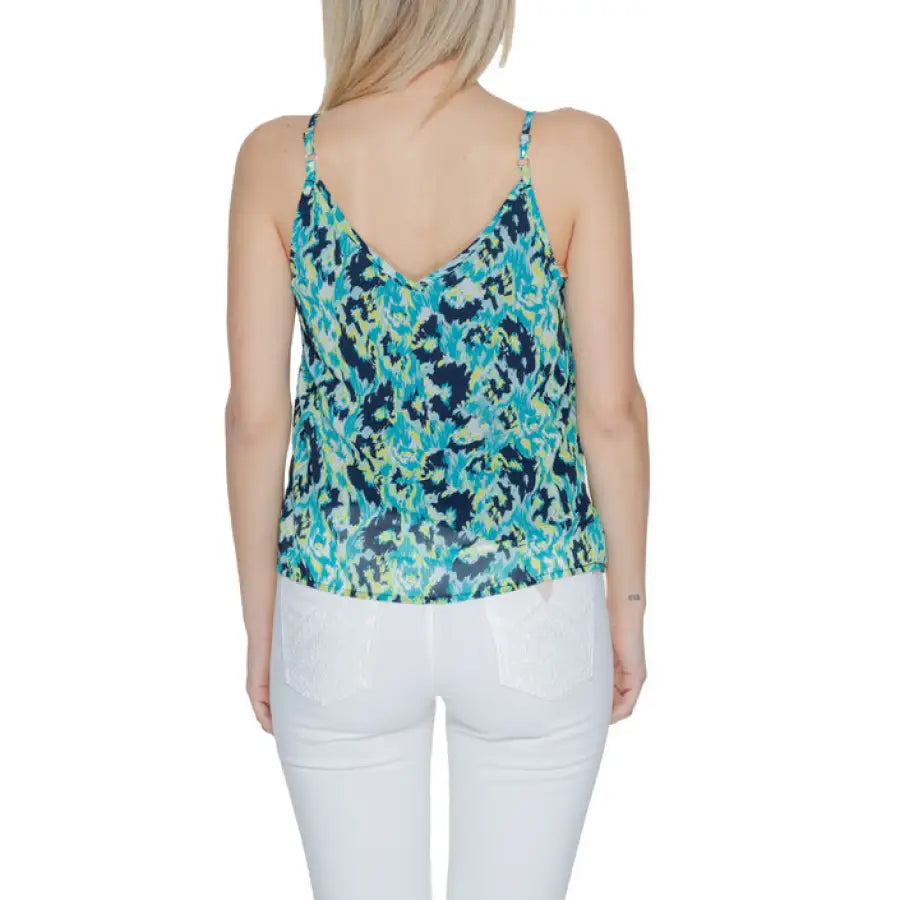 
                      
                        Woman in Morgan De Toi undershirt with blue and green floral print, urban city style
                      
                    