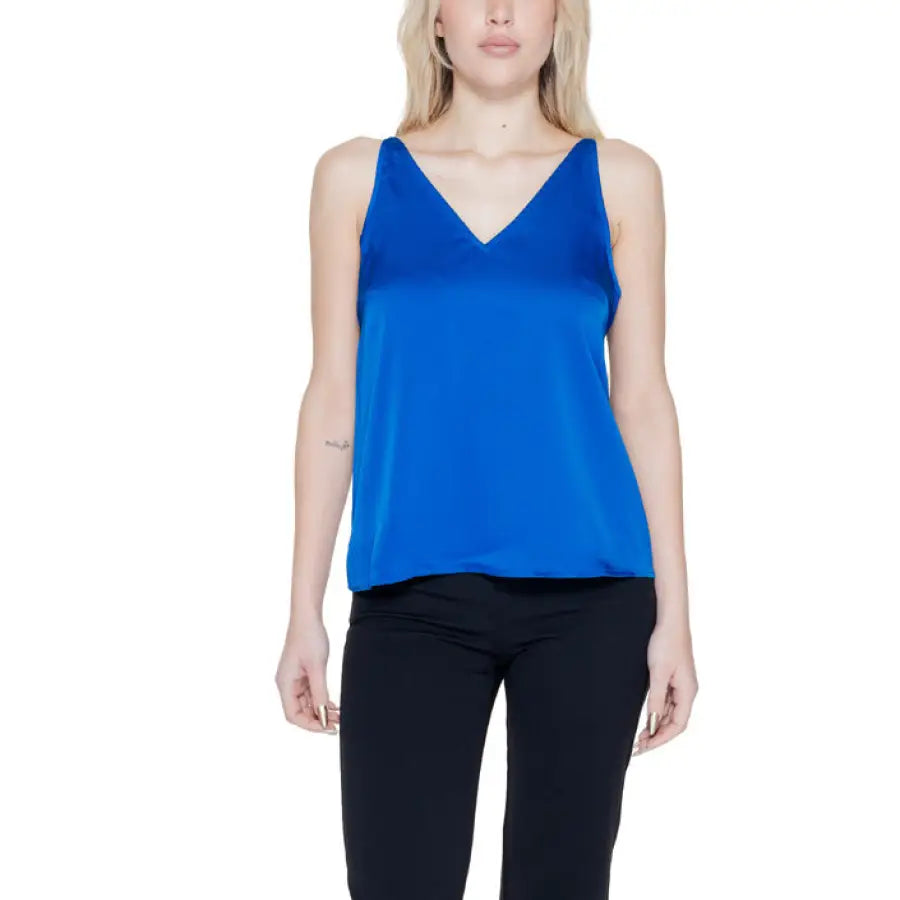 
                      
                        Woman in blue Vila Clothes top showcasing urban style clothing
                      
                    