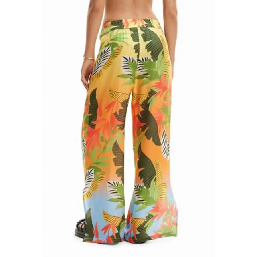 Woman in Desigual tropical print pants showcases urban city style