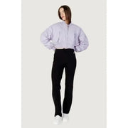Woman in cropped lavender jacket and black pants from Calvin Klein Jeans Women Jacket
