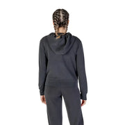 Woman wearing Guess Active Women Black Long Hooded Zip Sweatshirt in dark gray tracksuit