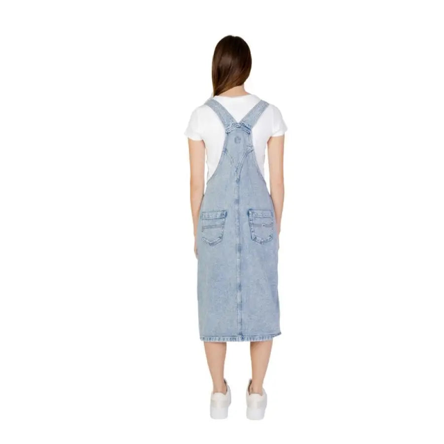 
                      
                        Woman in Tommy Hilfiger jeans dungaree dress.
                      
                    