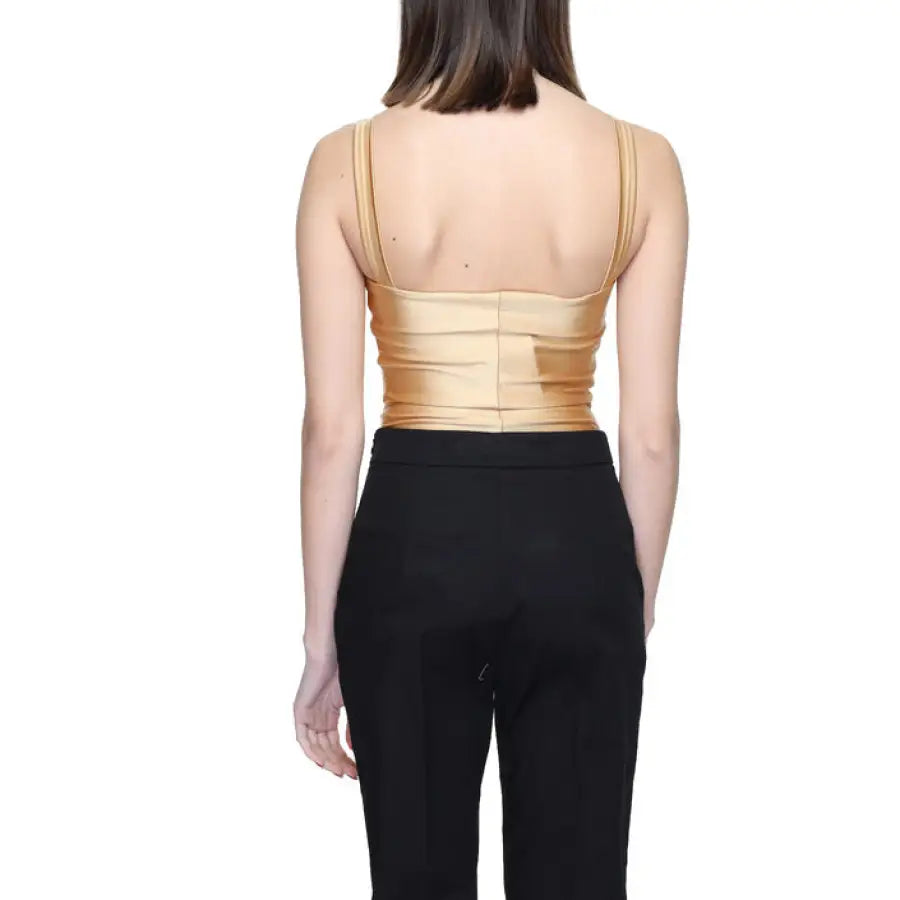 Woman in gold top & black pants for Silence Women Underwear - urban city style clothing