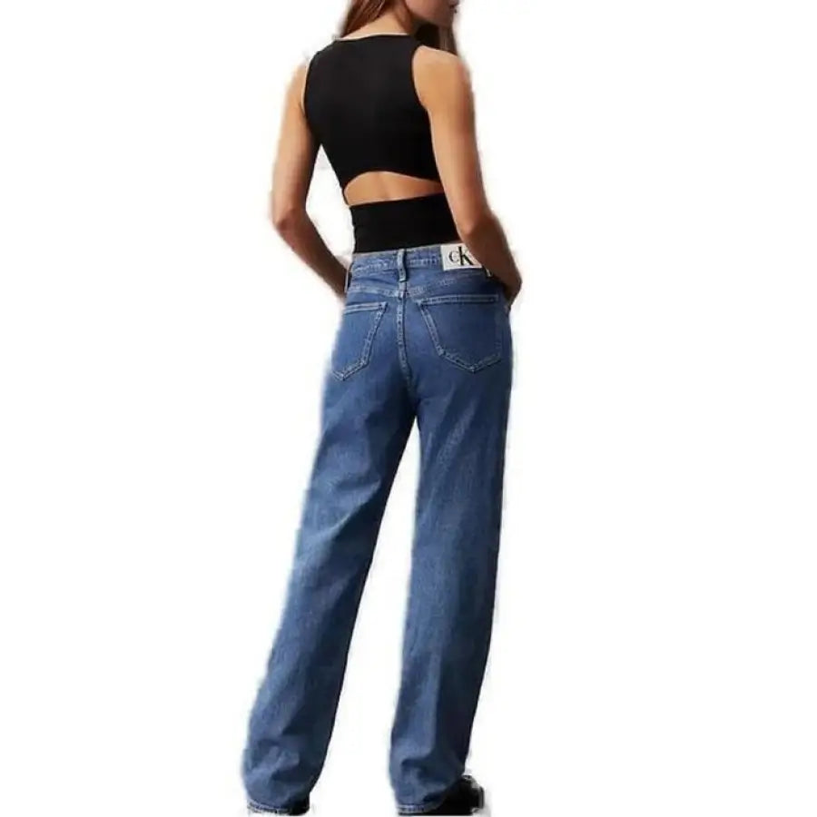 
                      
                        Woman in Calvin Klein Jeans and black top showcasing Calvin Klein Women Top
                      
                    