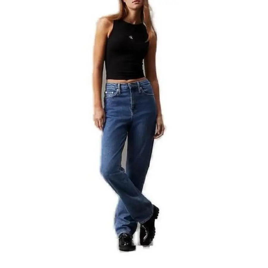 
                      
                        Calvin Klein model in sleek jeans and black top showcasing Calvin Klein Jeans Women Top
                      
                    