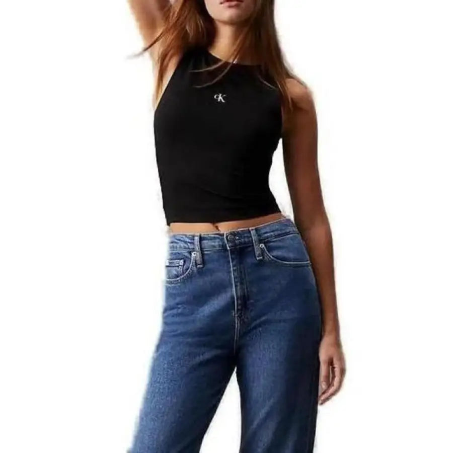 Calvin Klein Jeans - woman in black top and Klein jeans