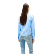 Woman facing away wearing Tommy Hilfiger Light Blue Organic Cotton Button Shirt and jeans