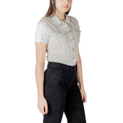 Woman wearing a light gray denim vest and black pants for the Light Gray Denim Vest and Black Pants product