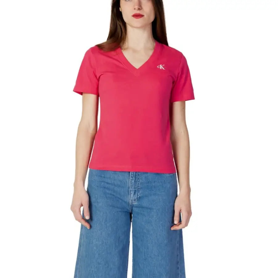 Woman in Calvin Klein jeans and pink Calvin Klein t-shirt
