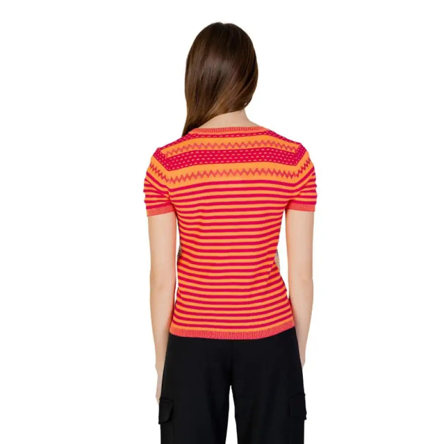 Woman in Desigual women knitwear with red-orange stripes