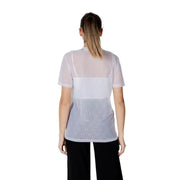 Woman wearing a sheer white top with a white tank beneath, featured in Women’s Sheer Top with White Tank product image