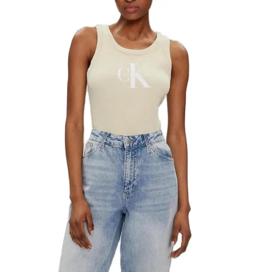 
                      
                        Calvin Klein jeans model wearing sleek tank top and Calvin Klein denim
                      
                    