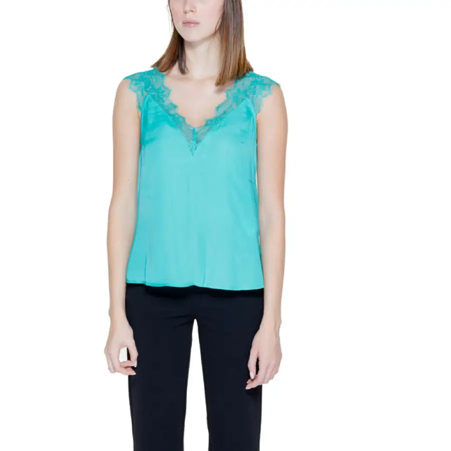 
                      
                        Woman in turquoise lace top from Morgan De Toi urban city fashion collection
                      
                    