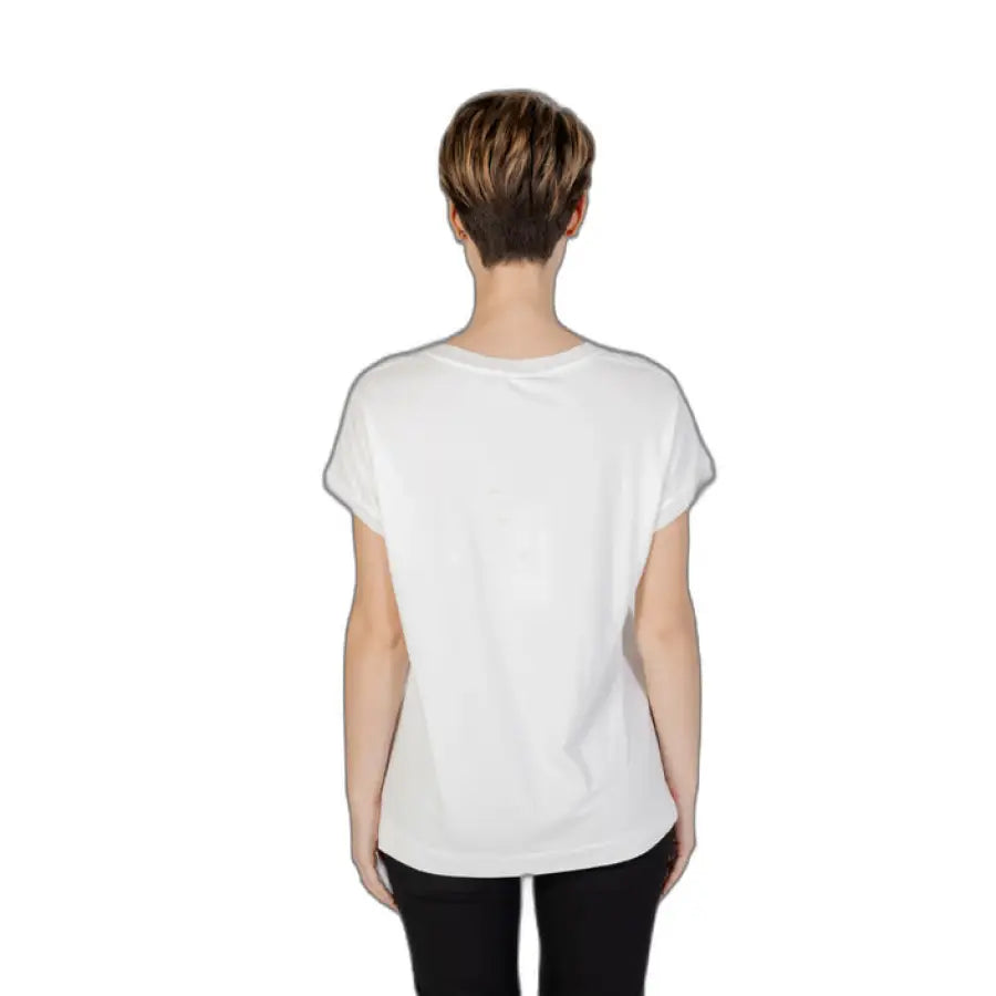 Sandro Ferrone woman in urban style clothing, white top with black pants